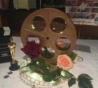 https://img1.yeggi.com/page_images_cache/2785806_free-vintage-film-reel-table-decoration-3d-printing-design-to-download